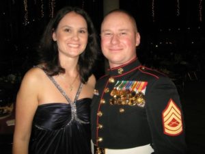 Steelworker Louis Bain II is pictured wearing his marine uniform. He's with his wife. Bain says the United Steelworkers helped his wife when he was deployed in Iraq